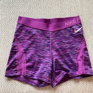 Purple Nike spandex shorts